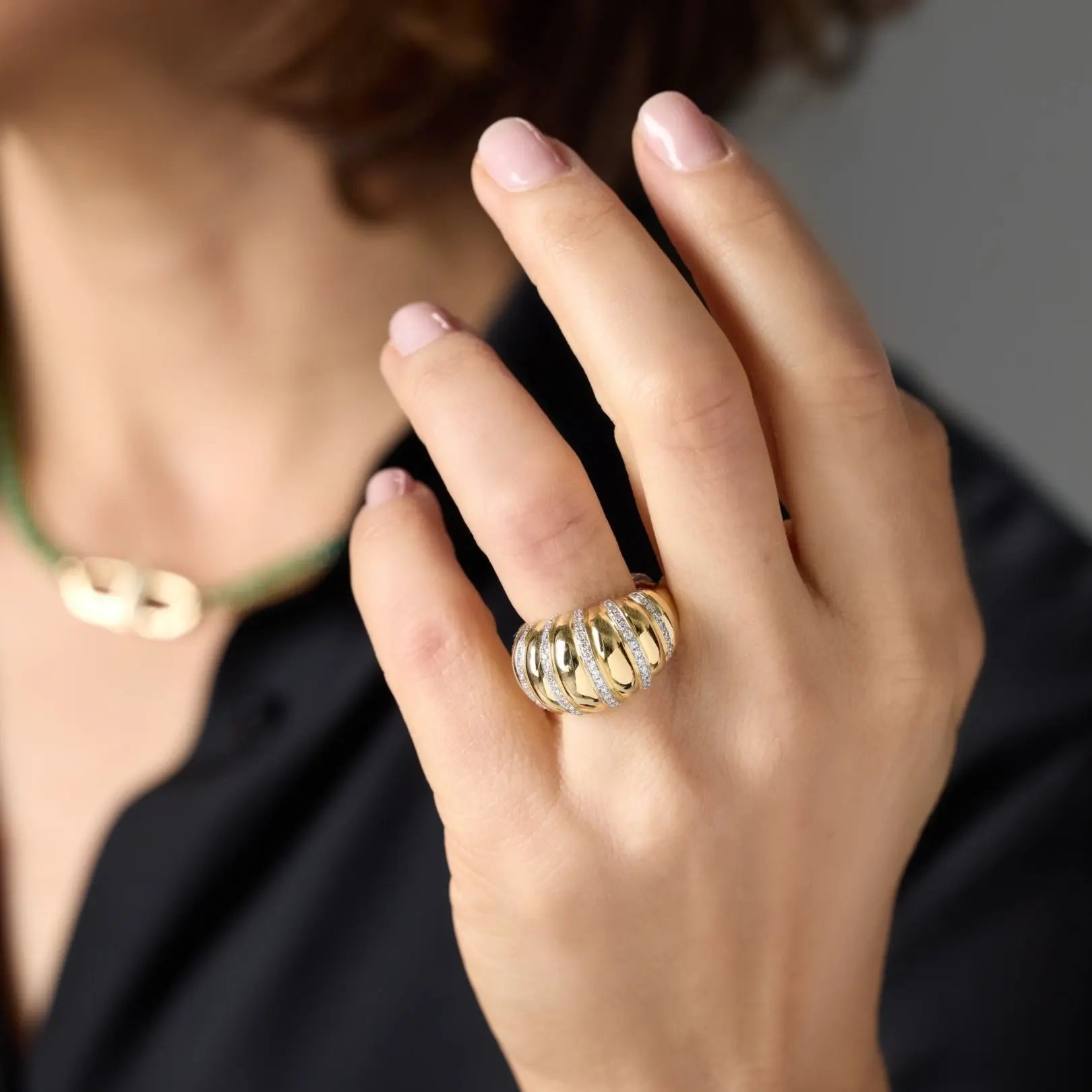 Yellow gold ridged dome ring with pavé diamonds