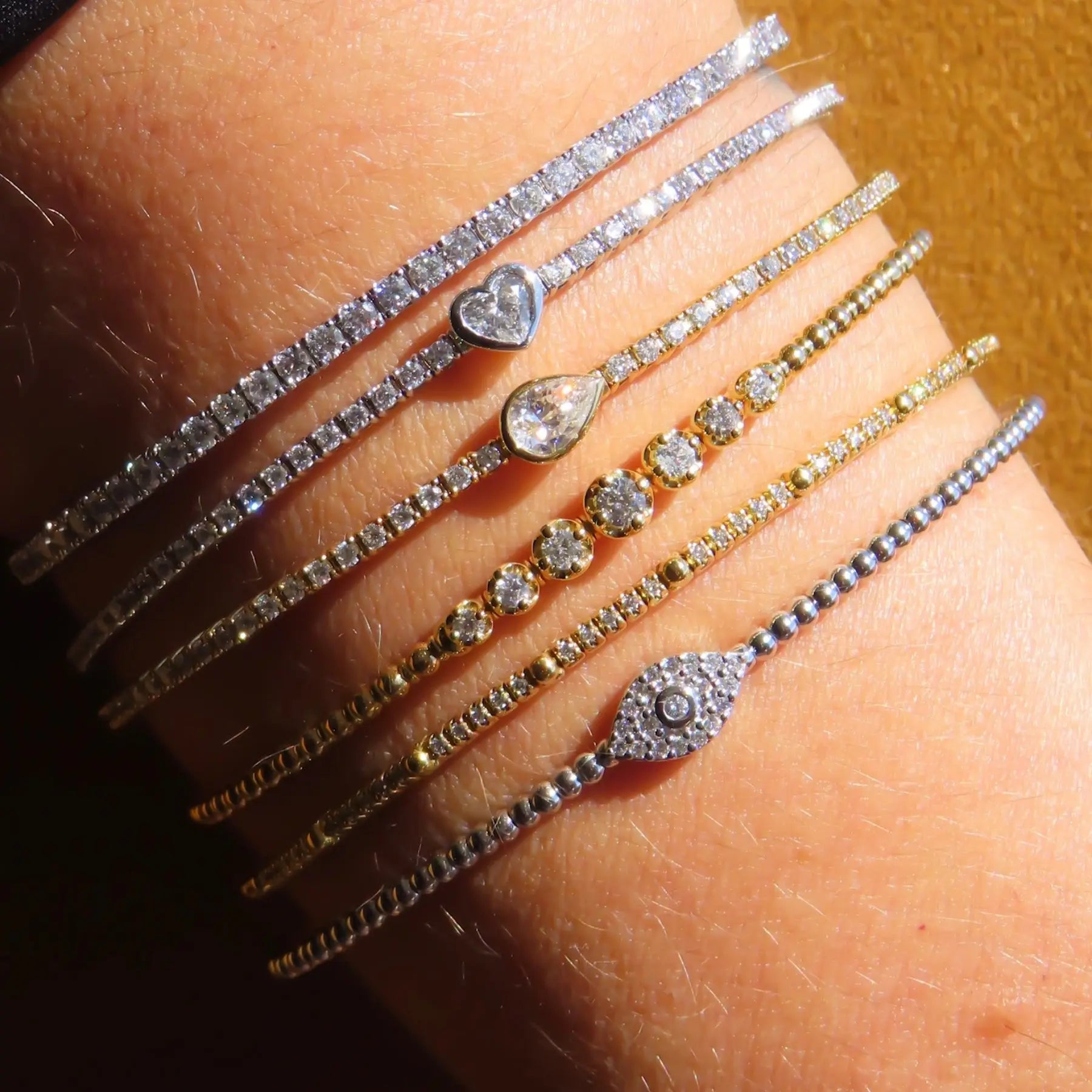 Diamond whisper flexible bangle in 18K gold by JJ Jewelry