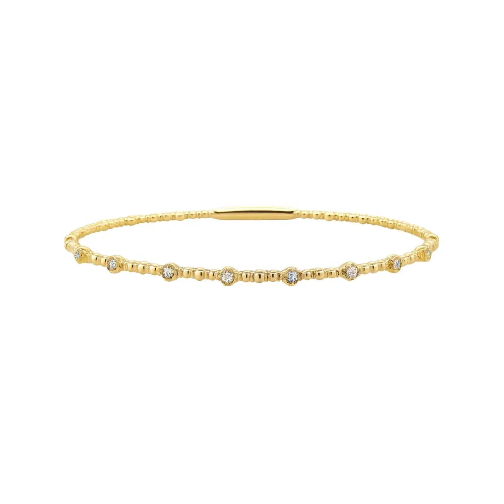 Dot diamond flexible bangle in 18K gold by JJ Jewelry