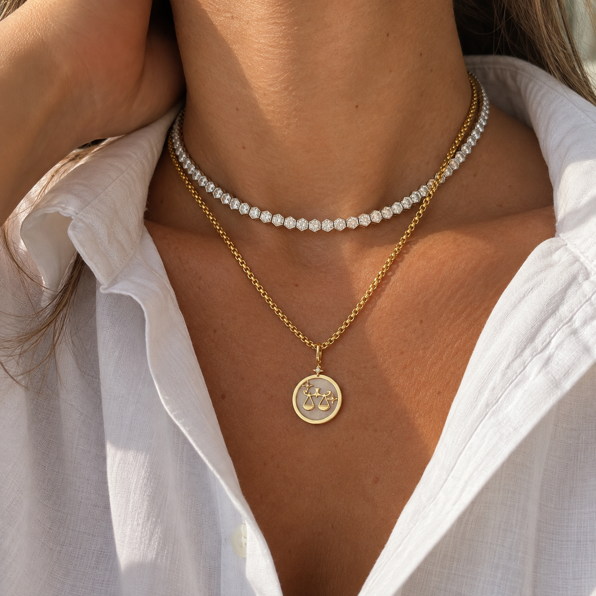 Libra Zodiac Pendant in 18K Yellow Gold with White Quartz & Diamonds, layered with a pearl necklace | JJ Jewelry Miami
