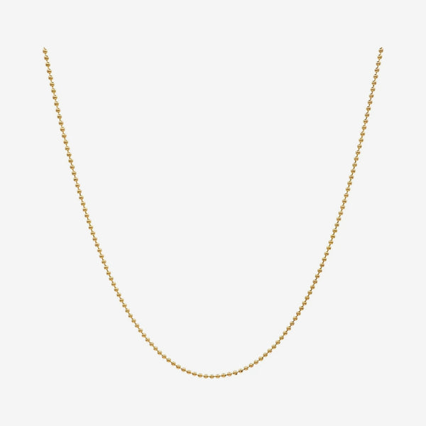Mini Ball Chain Necklace in 14K Yellow Gold, gray background | JJ Jewelry Miami