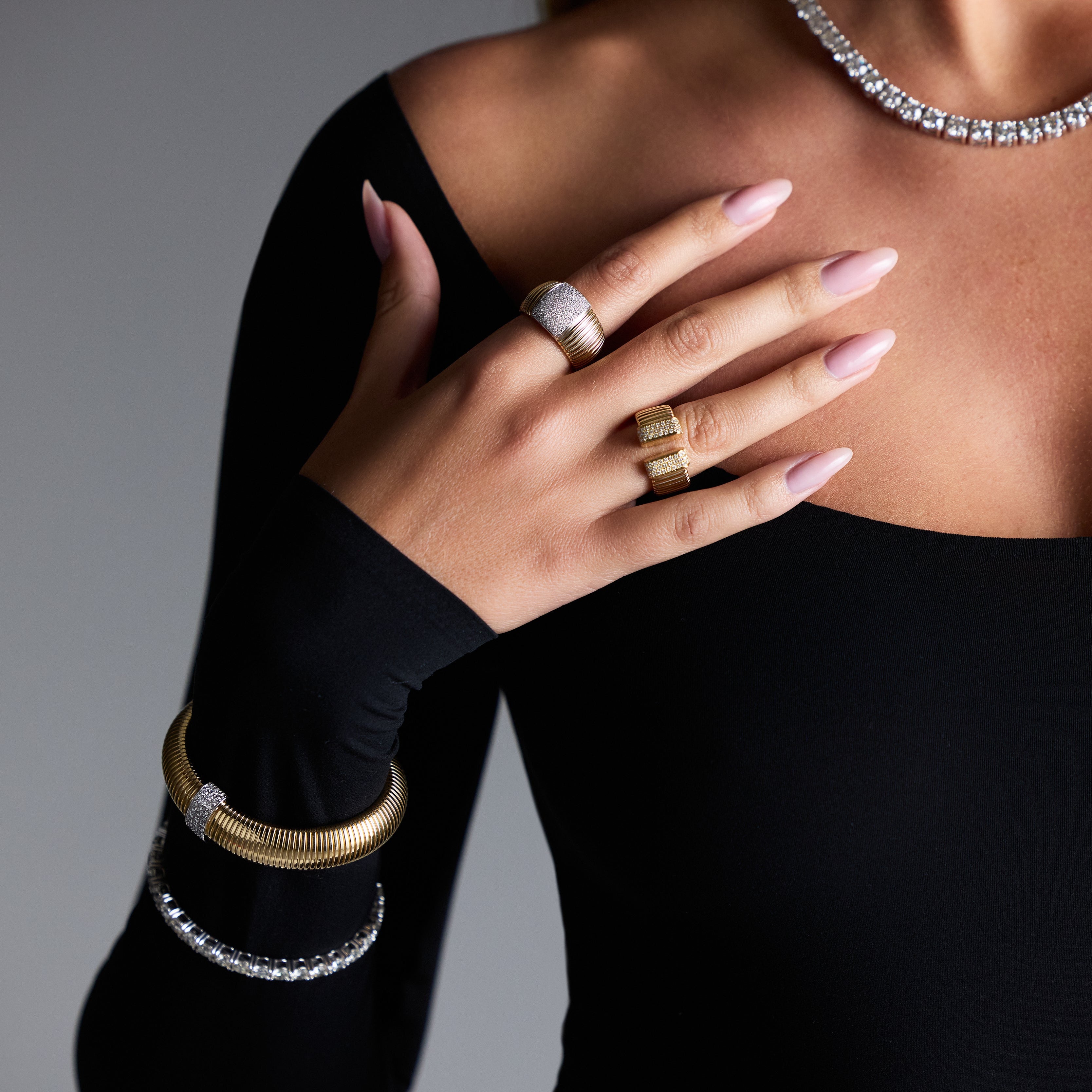 Open flex Italian ring featuring pavé-set diamonds in yellow gold