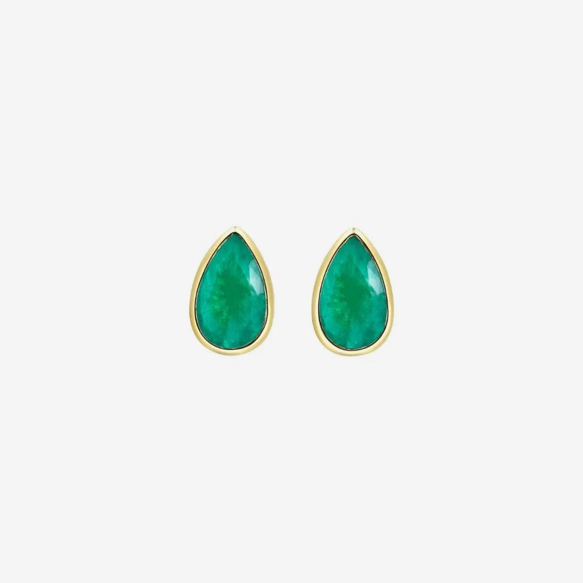 Pear Emerald Bezel Stud Earrings in 18K Yellow Gold, gray background | JJ Jewelry Miami