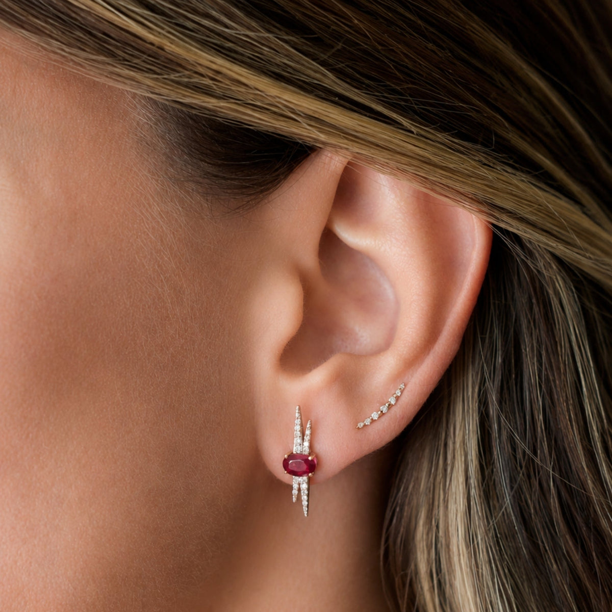 Ruby and Diamond Earrings in 14K Yellow Gold, on ear | JJ Jewelry Miami