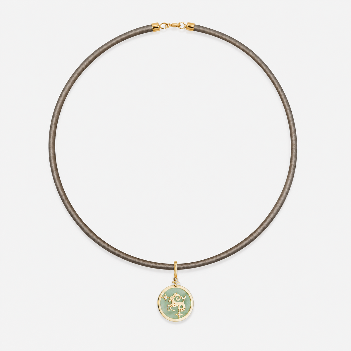 Capricorn Zodiac Pendant in 18K Yellow Gold with Green Quartz & Diamonds, styled on a taupe cord choker | JJ Jewelry Miami