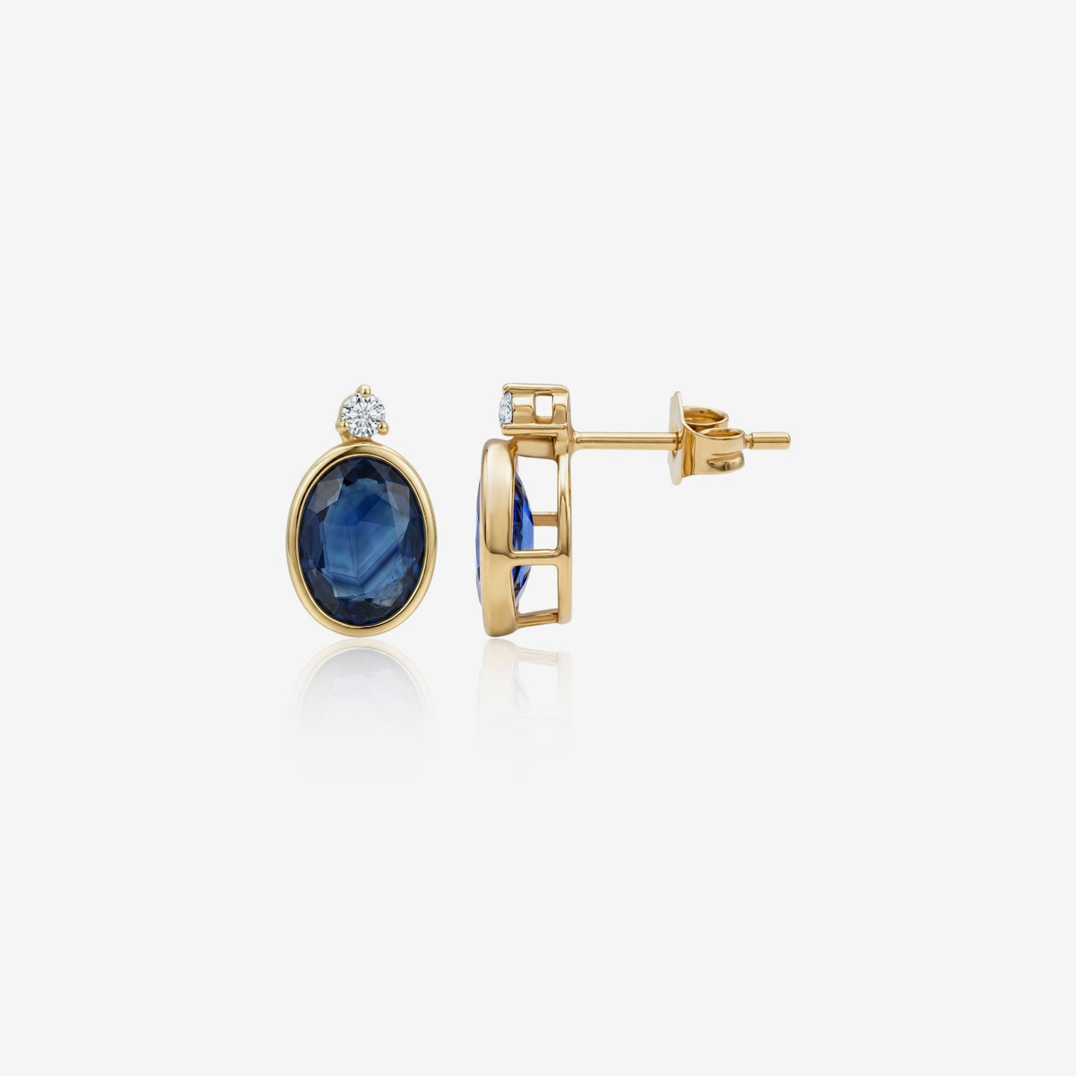 Oval Blue Sapphire Bezel Stud Earrings in 14K Yellow Gold | JJ Jewelry Miami