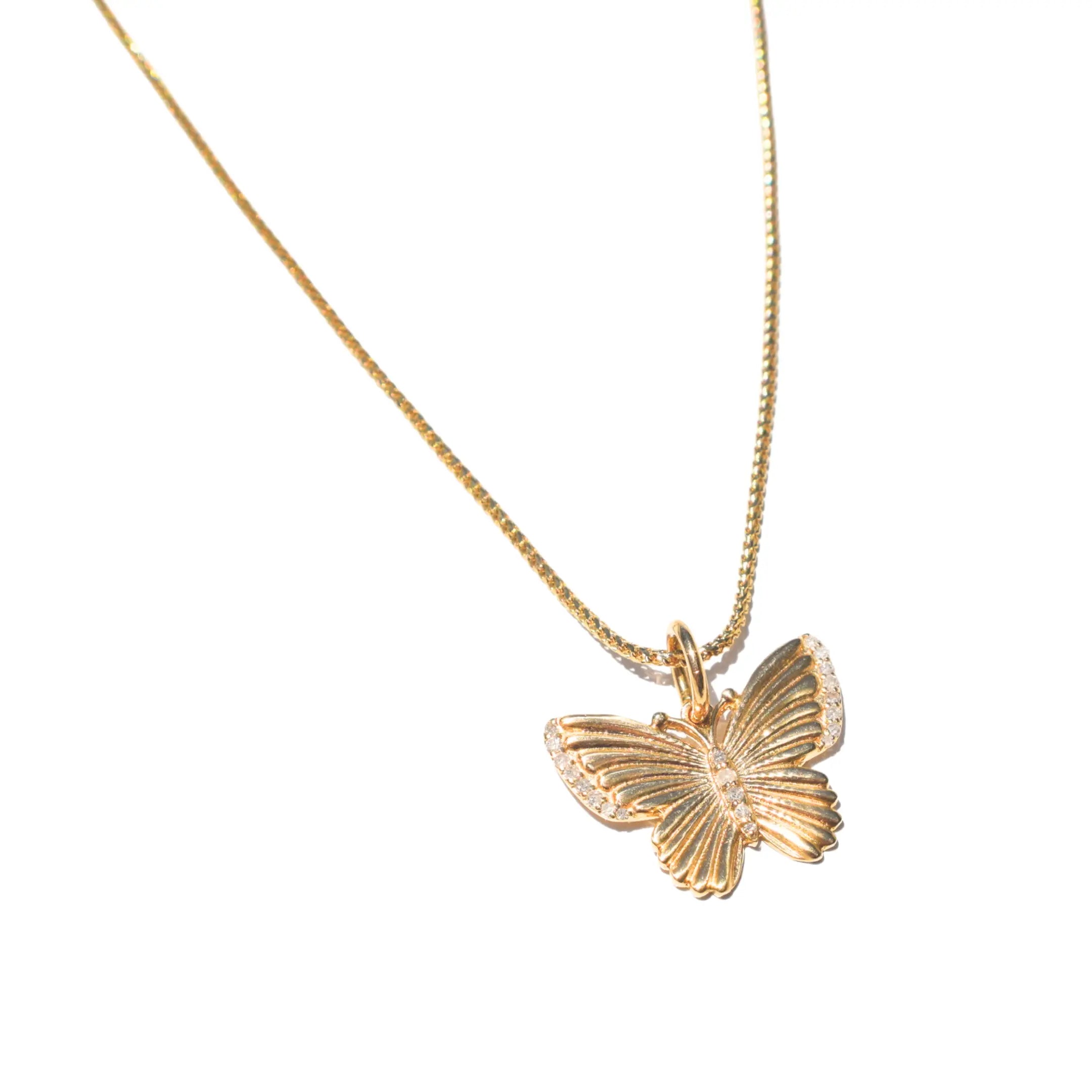 Elegant yellow gold butterfly pendant with diamonds