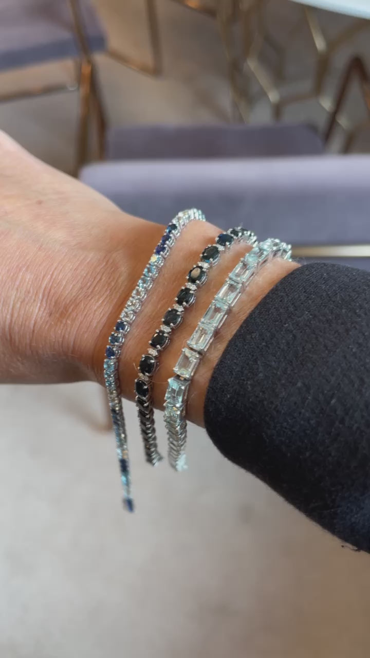 Blue sapphire and diamond bracelet in 18K white gold by JJ Jewelry