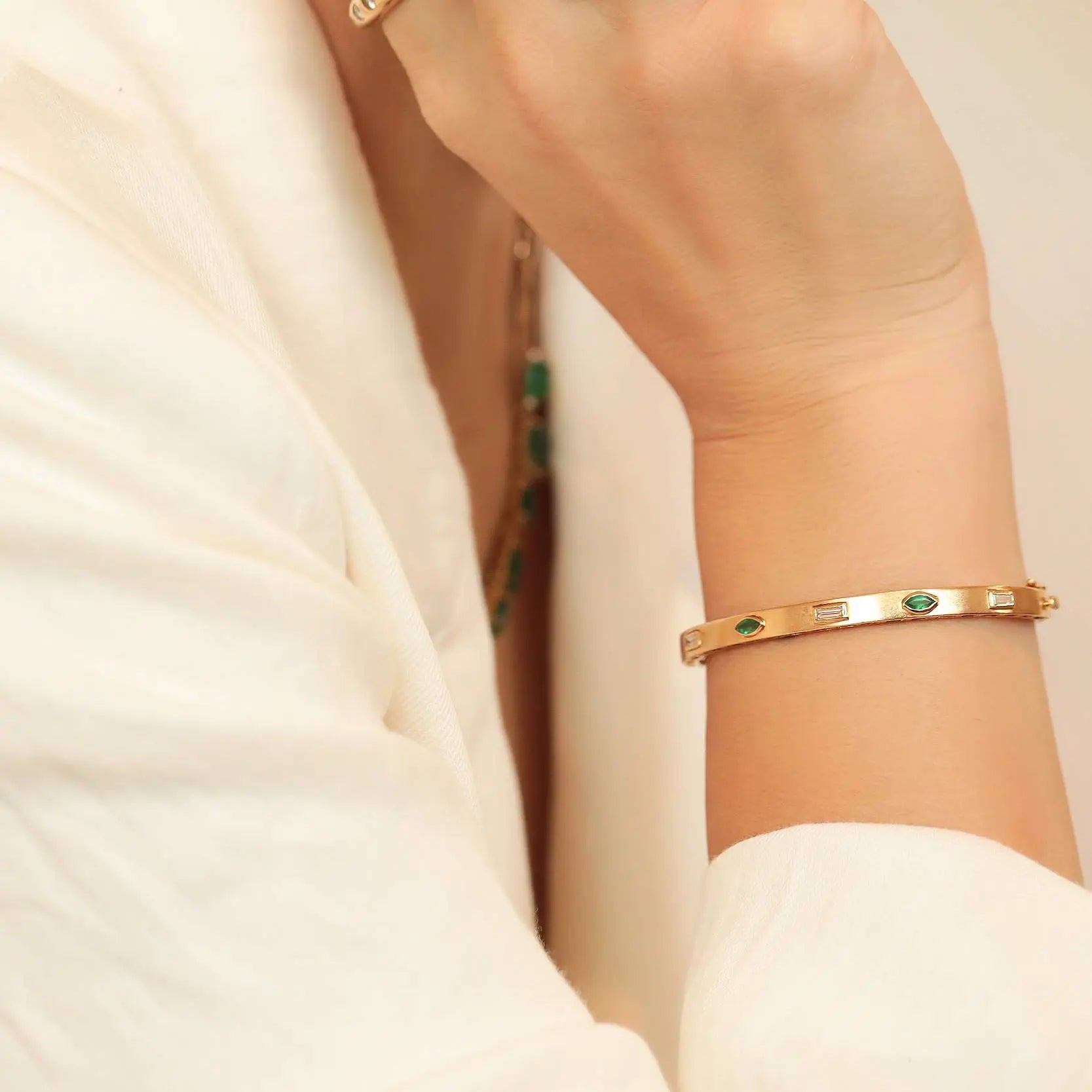 Bezel-Set Emerald & Diamond Bangle in 14K Yellow Gold | JJ Jewelry Miami