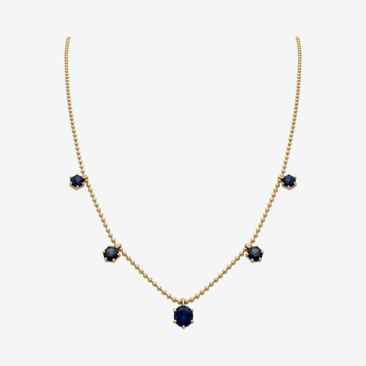 Blue Sapphire Dancing Chain Necklace in 18K Yellow Gold, gray background | JJ Jewelry Miami