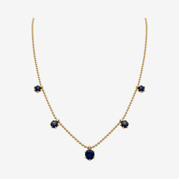 Blue Sapphire Dancing Chain Necklace in 18K Yellow Gold, gray background | JJ Jewelry Miami
