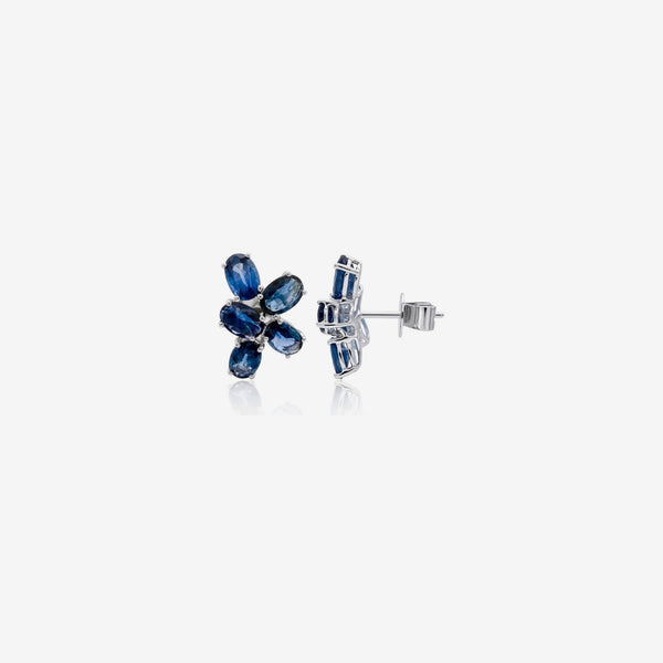 Blue Sapphire Flower Cluster Earrings in 18K White Gold, gray background | JJ Jewelry Miami