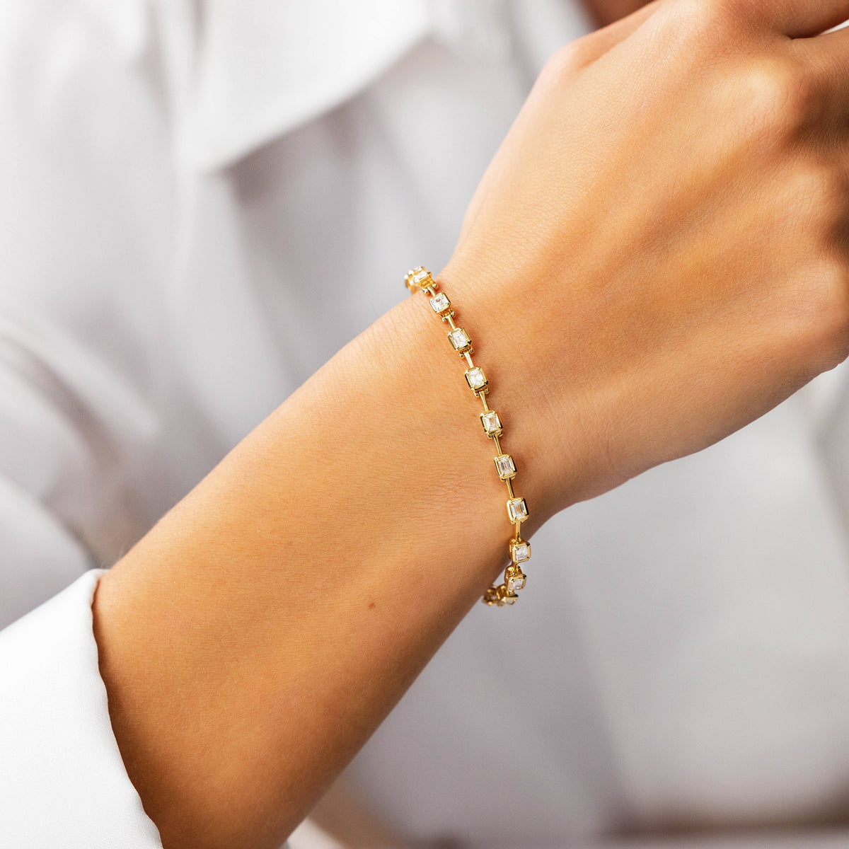 Emerald-Cut Diamond Spaced Bracelet in Yellow Gold, lifestyle view 1 | JJ Jewelry