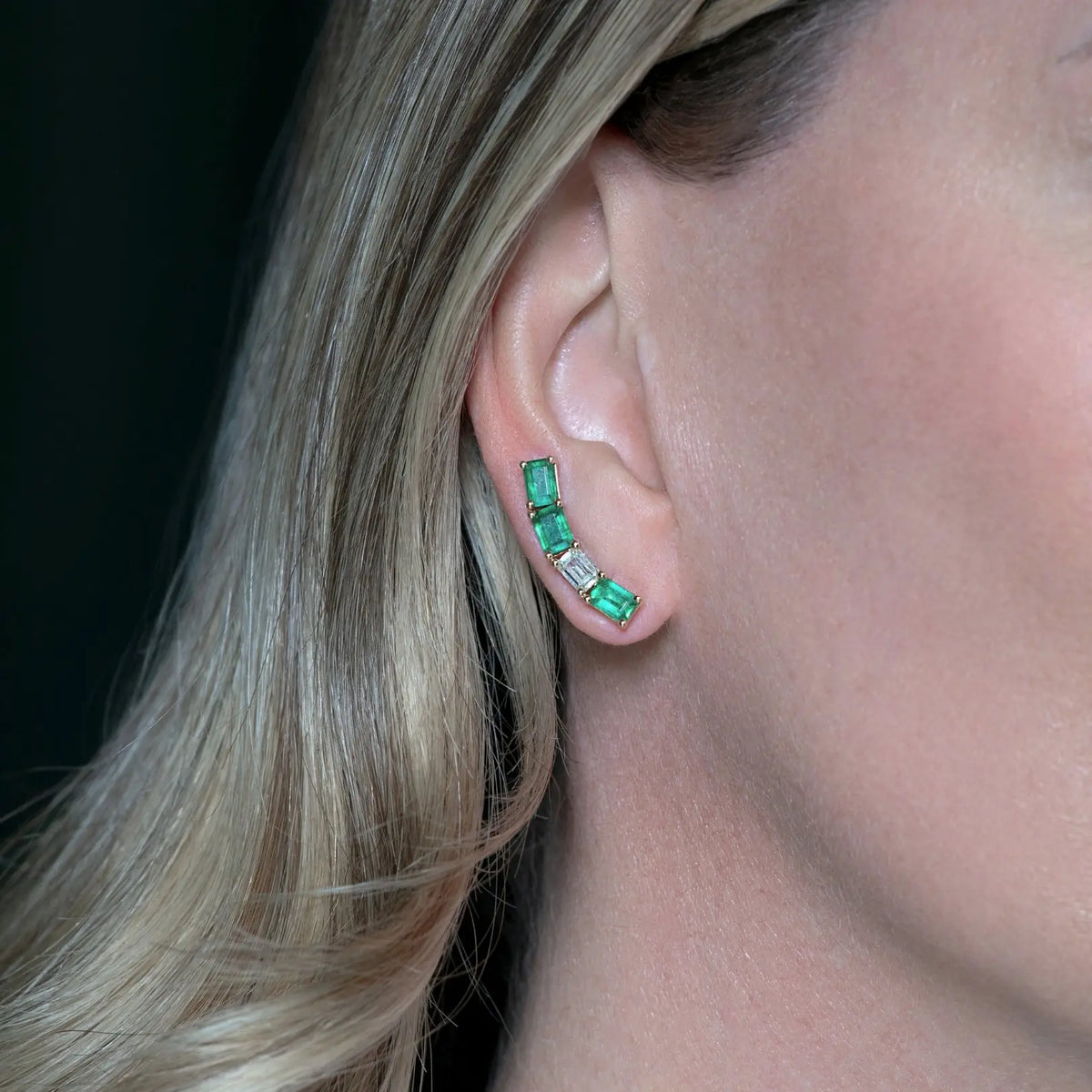 Emerald and Diamond Baguette Ear Crawlers in 18K Yellow Gold, on ear | JJ Jewelry Miami