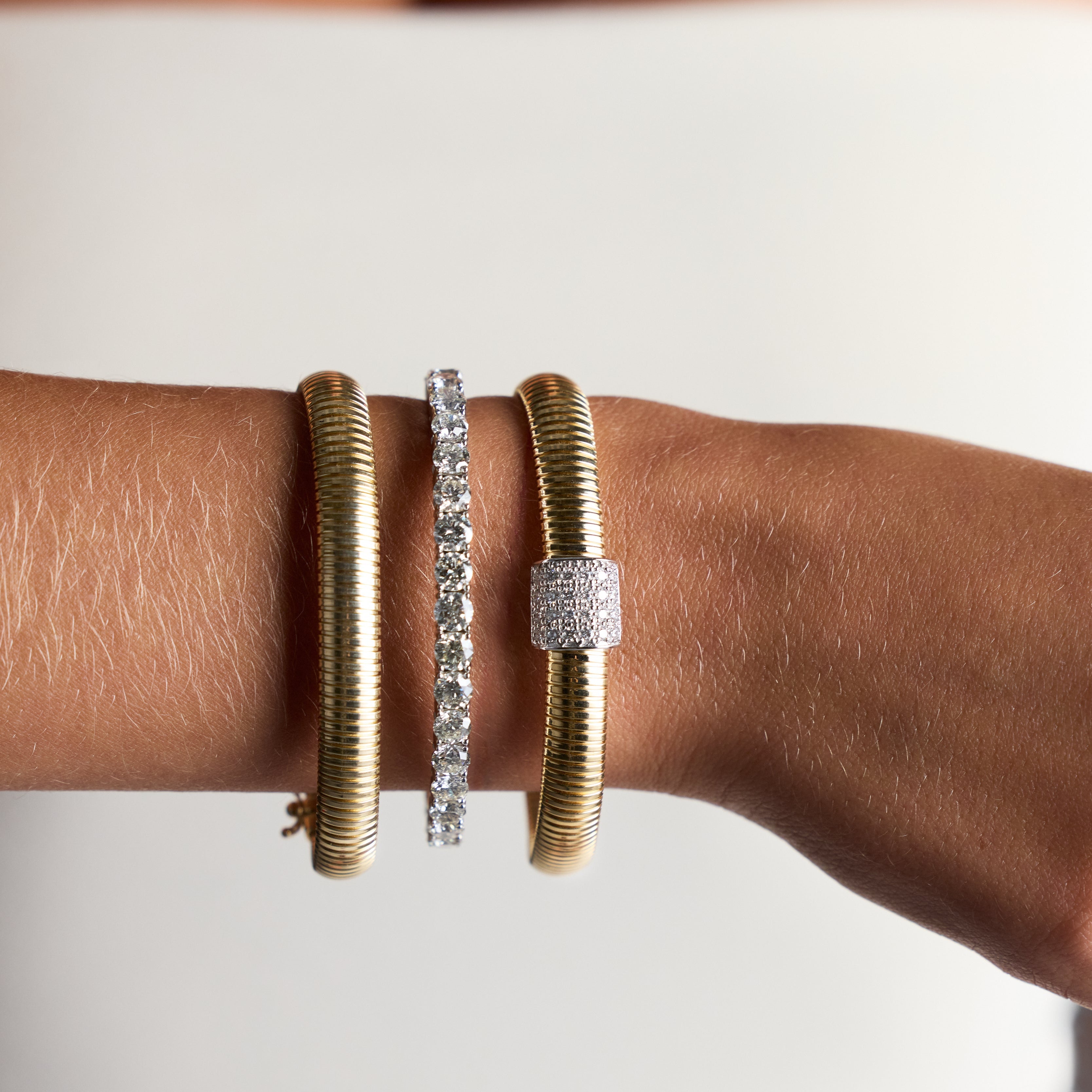 Bold sculptural snake-style gold bracelet in 14K yellow gold