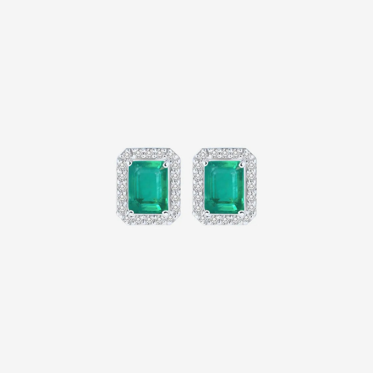 Gemstone and Diamond Halo Stud Earrings in 18K White Gold with Emerald, gray background | JJ Jewelry Miami