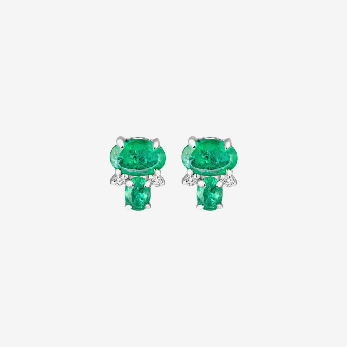 Oval and Cushion Emerald and Diamond Stud Earrings in 18K White Gold, gray background | JJ Jewelry Miami