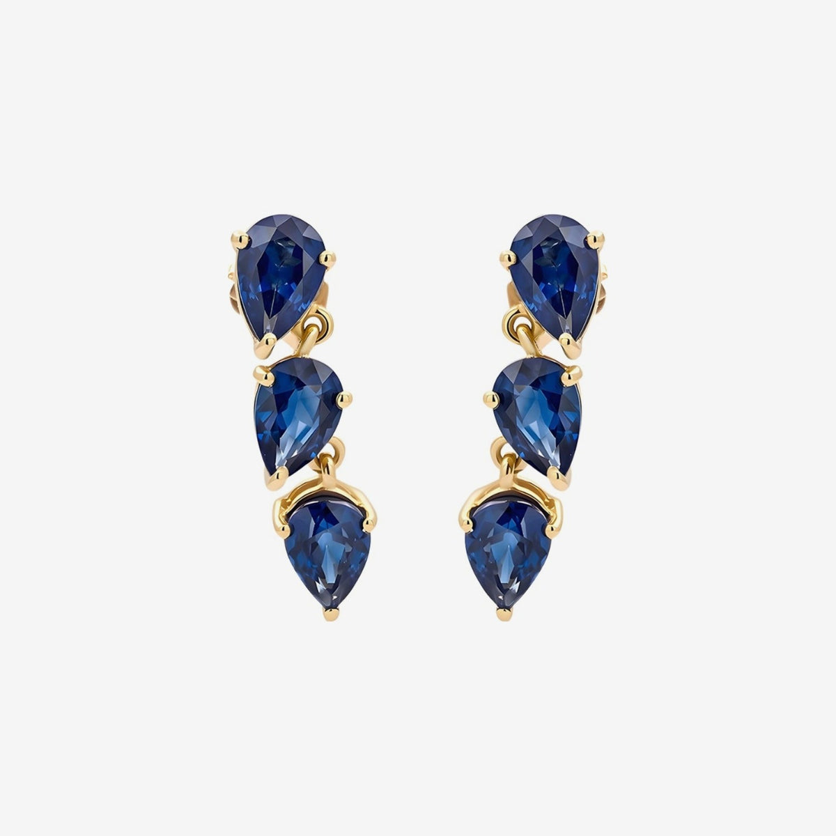 Three Pear Gemstone Dancing Earrings in 14K Yellow Gold with Blue Sapphire, gray background | JJ Jewelry Miami