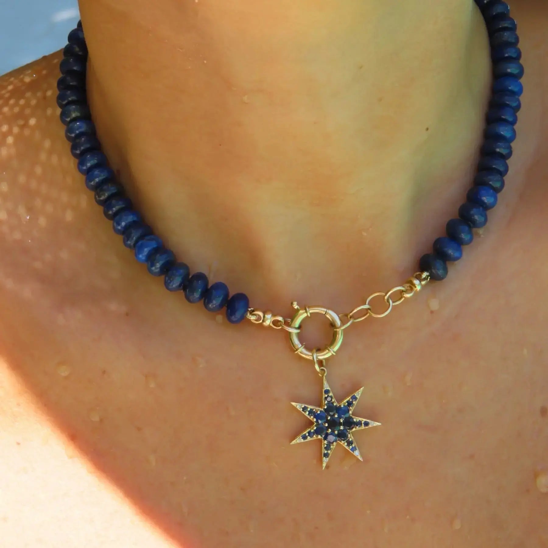 Blue lapis lazuli beaded necklace with yellow gold connector