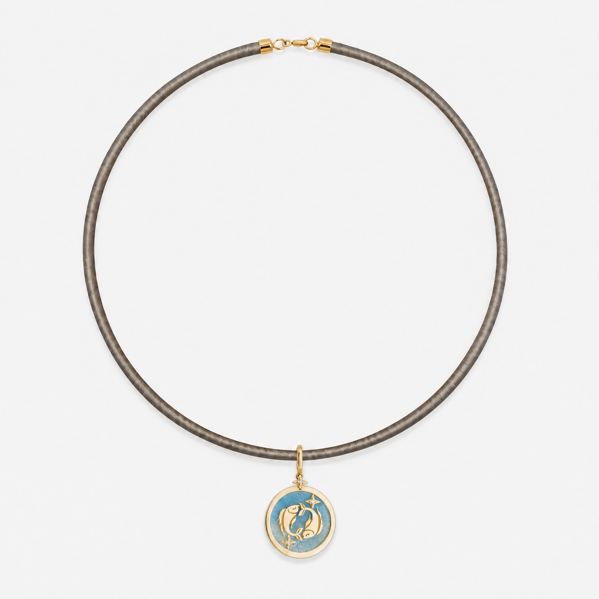 Pisces Zodiac Pendant in 18K Yellow Gold with Blue Quartz & Diamonds, styled on a taupe cord choker | JJ Jewelry Miami