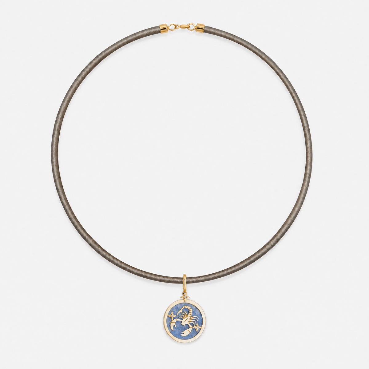 Scorpio Zodiac Pendant in 18K Yellow Gold with Blue Quartz & Diamonds, styled on a taupe cord choker | JJ Jewelry Miami