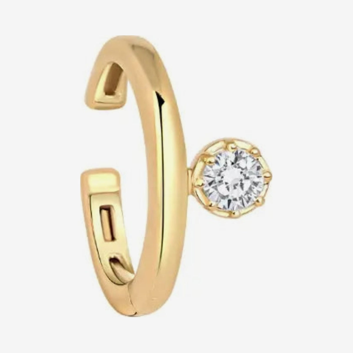 Single Diamond Ear Clip in 18K Yellow Gold, gray background | JJ Jewelry Miami