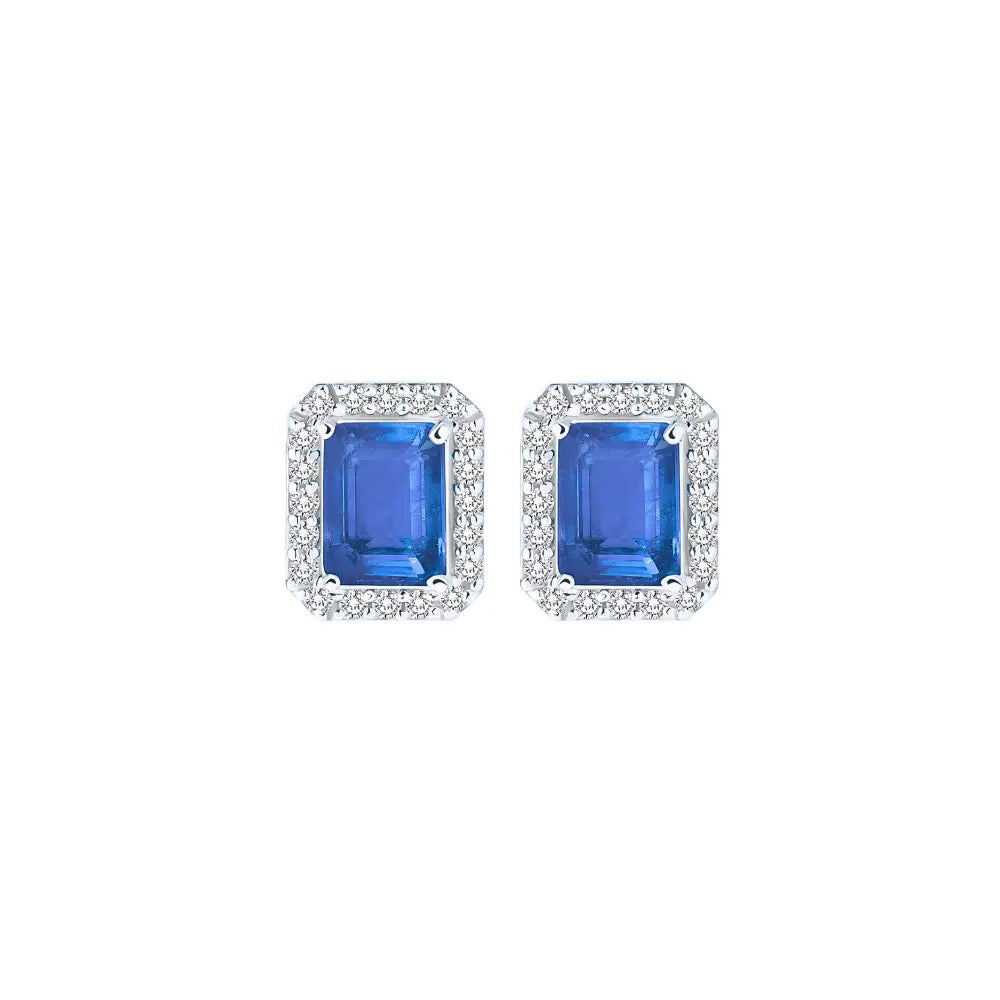 Tanzanite halo stud earrings framed by diamonds in 18K yellow gold
