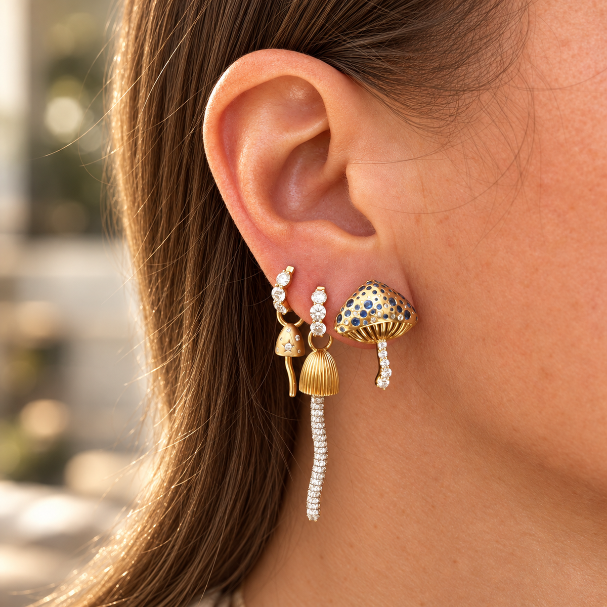 Tiny Mushroom Black Diamond Charm in 18K Yellow Gold by Alessa Rocks, worn on a huggie in a mushroom ear stack | JJ Jewelry Miami